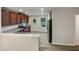 Well-lit kitchen featuring stainless steel appliances, granite countertops, and classic wooden cabinetry at 400 Collington Dr, Mebane, NC 27302