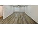 Living room featuring wood-look floors, white walls and trim, and recessed lights, with a view to the outside at 400 Collington Dr, Mebane, NC 27302