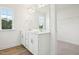 Bright bathroom featuring double sinks and a large mirror, creating a functional space at 420 Shelby Meadow Ln, Angier, NC 27501