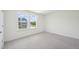 Sun-filled bedroom with double windows offering a view of the neighborhood at 420 Shelby Meadow Ln, Angier, NC 27501