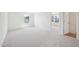 Bright bedroom with neutral carpet, fresh paint, and natural light from the windows at 420 Shelby Meadow Ln, Angier, NC 27501