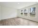Bedroom with light wood flooring and large windows offering ample natural light and a view at 420 Shelby Meadow Ln, Angier, NC 27501