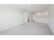 Spacious bonus room featuring neutral carpet and entryways to bathroom and bedroom at 420 Shelby Meadow Ln, Angier, NC 27501