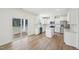 Bright open kitchen featuring stainless appliances, a center island, modern cabinets, and access to an outdoor patio at 420 Shelby Meadow Ln, Angier, NC 27501