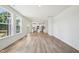 Bright, open-concept living room flows into a modern kitchen with stainless steel appliances and hardwood floors at 420 Shelby Meadow Ln, Angier, NC 27501