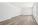 Spacious living room with wood floors and abundant natural light from the large windows at 420 Shelby Meadow Ln, Angier, NC 27501