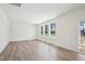 Bright living room with wood floors, offering access to a covered patio and lots of natural light at 420 Shelby Meadow Ln, Angier, NC 27501