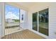 Covered porch with wooden floors overlooking a new home construction site at 420 Shelby Meadow Ln, Angier, NC 27501