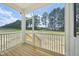 Inviting screened porch with wood flooring and a peaceful view of the expansive backyard at 420 Shelby Meadow Ln, Angier, NC 27501