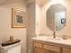 Well lit bathroom with vanity and marble countertop at 4203 Norman Ridge Ln, Raleigh, NC 27613