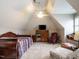 Cozy bedroom with unique ceiling, fan, tv, and comfortable seating area at 4203 Norman Ridge Ln, Raleigh, NC 27613