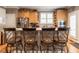 Kitchen bar with stainless steel appliances, light wood cabinets, and a view to the outside at 4203 Norman Ridge Ln, Raleigh, NC 27613