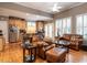 Open concept living room flowing into a kitchen with stainless steel appliances and a breakfast bar at 4203 Norman Ridge Ln, Raleigh, NC 27613
