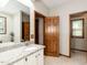 Well-lit bathroom boasts a double sink vanity, bathtub, and a separate entrance at 422 Old Scarborough Ln, Garner, NC 27529