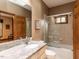 Bright bathroom featuring a granite countertop and glass shower door at 422 Old Scarborough Ln, Garner, NC 27529