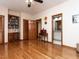 Spacious bedroom featuring hardwood floors, built-in shelves, and ensuite bathroom at 422 Old Scarborough Ln, Garner, NC 27529