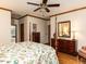 Inviting main bedroom features hardwood floors and a four-poster bed and ensuite bathroom at 422 Old Scarborough Ln, Garner, NC 27529