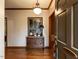 Inviting foyer features hardwood floors, an ornate chest, and a decorative light fixture at 422 Old Scarborough Ln, Garner, NC 27529