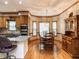 Sunlit kitchen with granite countertops, stainless appliances, and an adjacent breakfast nook at 422 Old Scarborough Ln, Garner, NC 27529