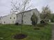Exterior backyard view showcasing the manicured lawn and rear facade at 4610 Miller Dr, Durham, NC 27704
