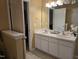 Bathroom featuring dual sinks and a neutral color palette at 4610 Miller Dr, Durham, NC 27704