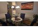 View of the dining room with glass table and decorative lighting at 4610 Miller Dr, Durham, NC 27704