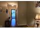Inviting entryway featuring hardwood floors, a decorative table, and a view of the front door at 4610 Miller Dr, Durham, NC 27704