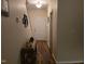 Inviting entryway featuring hardwood floors, a decorative table, and a white front door at 4610 Miller Dr, Durham, NC 27704