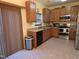 Eat-in kitchen featuring stainless steel appliances and hardwood flooring at 4610 Miller Dr, Durham, NC 27704