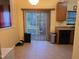 Bright eat-in kitchen with stainless steel appliances and access to the patio at 4610 Miller Dr, Durham, NC 27704