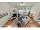 Spacious living room boasts hardwood floors, fireplace, and ample natural light at 4709 Knights Arm Dr, Durham, NC 27707