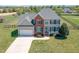 Beautiful two-story home with a spacious yard, perfect for outdoor activities and relaxation at 4905 Homestead Dr, Mebane, NC 27302