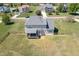 Expansive backyard with a covered porch, patio, and fenced perimeter, perfect for outdoor enjoyment at 4905 Homestead Dr, Mebane, NC 27302