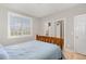 Comfortable bedroom with wood flooring and natural light from the window at 4905 Homestead Dr, Mebane, NC 27302
