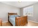 Bedroom features wood flooring, a full bed and natural light at 4905 Homestead Dr, Mebane, NC 27302