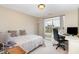 Bedroom features two windows, carpet, and a desk area at 4905 Homestead Dr, Mebane, NC 27302