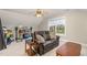 Bonus room with comfortable seating and natural light from the window at 4905 Homestead Dr, Mebane, NC 27302