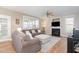 Bright living room with a fireplace, hardwood floors, and large windows at 4905 Homestead Dr, Mebane, NC 27302