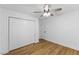 Bedroom featuring wood floor, closet and ceiling fan at 508 N Charles St, Mebane, NC 27302