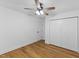 Bedroom featuring wood floor, closet and ceiling fan at 508 N Charles St, Mebane, NC 27302