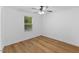 Bedroom featuring wood floor, ceiling fan and window at 508 N Charles St, Mebane, NC 27302
