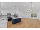 Bright kitchen with white cabinets, stainless steel appliances, and center island at 508 N Charles St, Mebane, NC 27302
