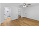 Bright main bedroom featuring an ensuite bathroom, walk in closet and wood floors at 508 N Charles St, Mebane, NC 27302