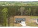 Beautiful aerial view of the home in a wooded lot, complemented by a lush green landscape at 52 Sagebrook Ct, Zebulon, NC 27597
