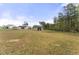 Large backyard with a storage shed, offering plenty of room for outdoor activities and potential landscaping projects at 52 Sagebrook Ct, Zebulon, NC 27597