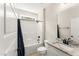Clean, well-lit bathroom with granite countertop, white cabinets, and shower-tub combination at 52 Sagebrook Ct, Zebulon, NC 27597