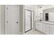 Neutral bathroom features a glass shower, granite counters, and custom cabinetry at 52 Sagebrook Ct, Zebulon, NC 27597