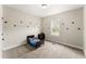 bedroom features carpet floors, a window, and dinosaur decor at 52 Sagebrook Ct, Zebulon, NC 27597
