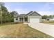 Beautiful house with a covered porch, a two-car garage and a landscaped front yard at 52 Sagebrook Ct, Zebulon, NC 27597