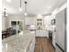 Bright kitchen features granite counters, stainless appliances and hardwood flooring at 52 Sagebrook Ct, Zebulon, NC 27597